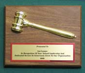 Image of a 7x9 bevel edge fiber board  with a gold tone plastic gavel releaf