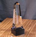 Image of a optical crystal obelisk with a black base