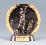 This is a image of dark resin with gold trim golf bowl featuring a male golfer with a golf bag.