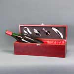 This is a image of a wine box with decanting tools
