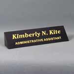 This is a image of a engraved black marble desk name plate