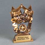 This is a image of a gold color resin of drama mask