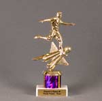 This is a image of a soccer player standing on a shooting star with a red stand set on a 2 inch by 3 inch white marble base 