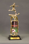 This is a image of a gold male soccer player standing on a spinning riser