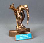 This is a image of a male swimer crouching on a starting block